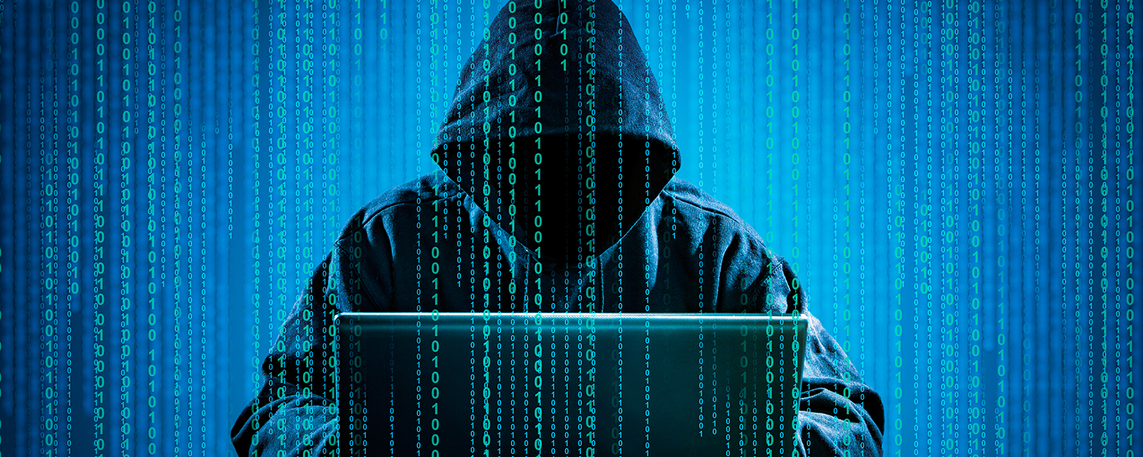 Hacker using laptop. Hacking the Internet.