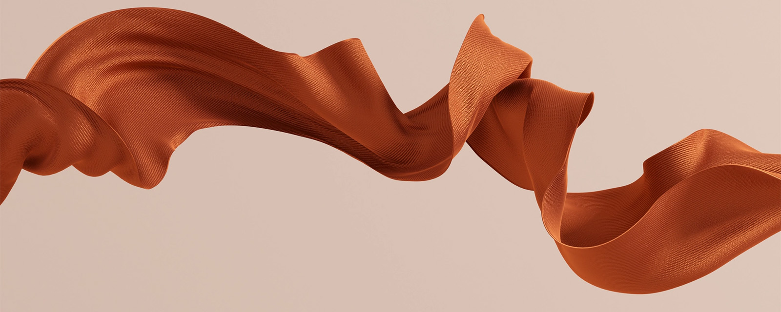 Burnt orange fabric floating in the air