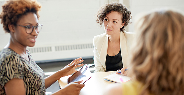 Three women in a meeting