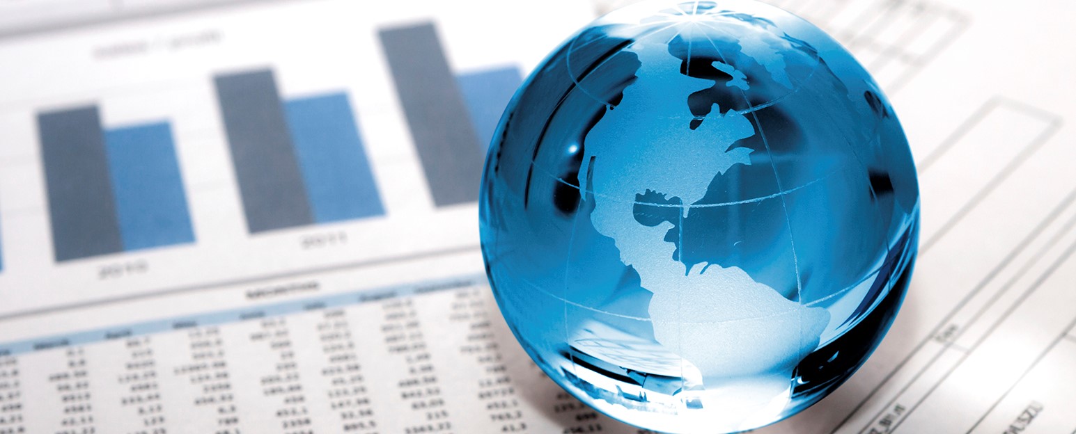 Glass globe on business documents