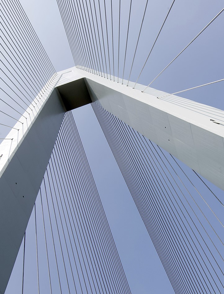 Looking up at a bridge