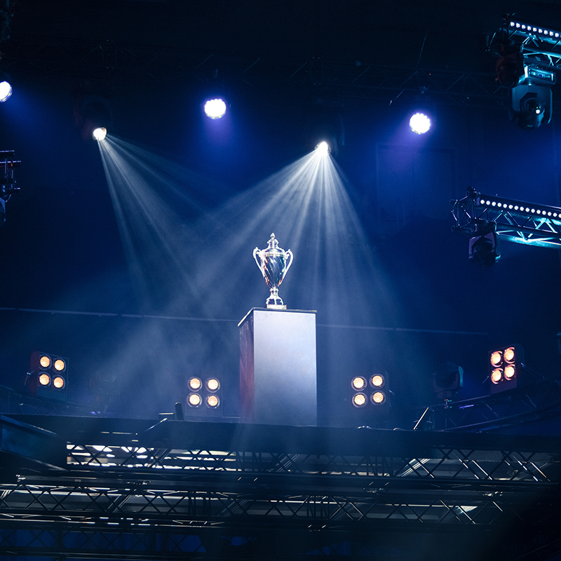 Trophy on a pedestal under lights