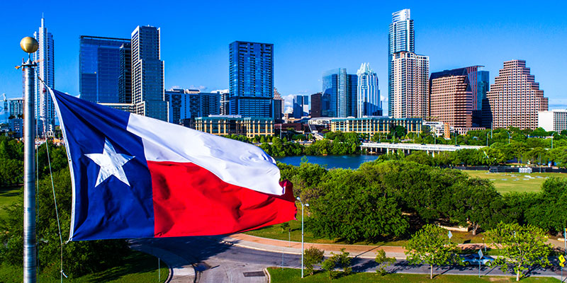 Austin skyline with Texas flag in foreground