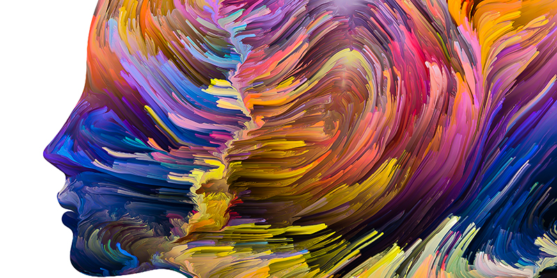 Textured paint in motion inside human face silhouette