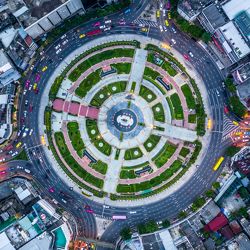 Aerial view road roundabout with car lots