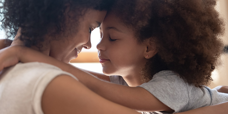 Mother and daughter embracing