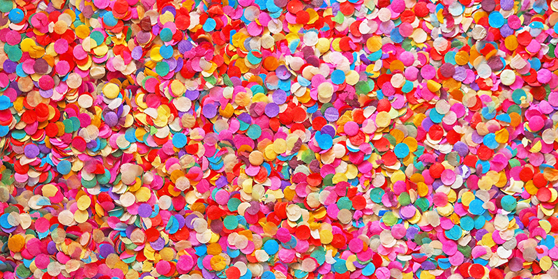 Confetti diversity background. Texture colored circles from paper, close-up.