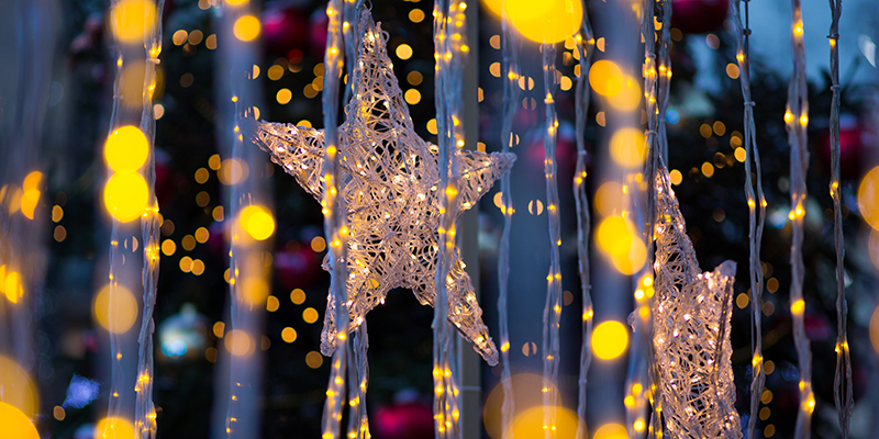 Christmas star, garland glowing lights. Bokeh, background concept