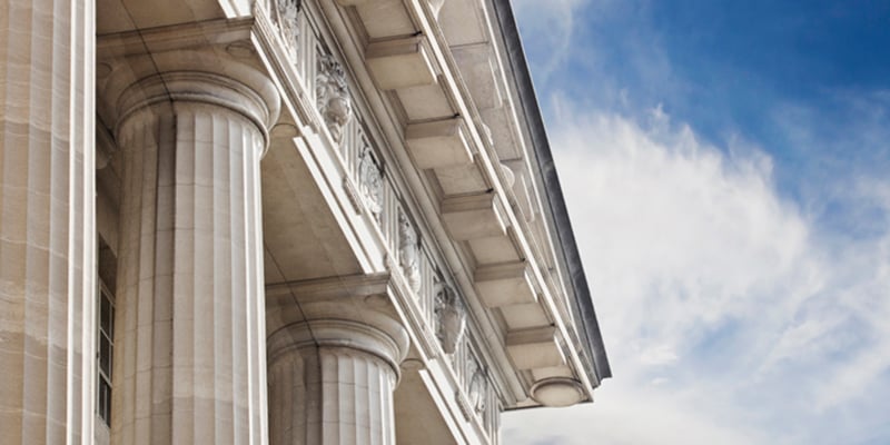 A close up look at a courthouse or government building with lots of copy space to the right