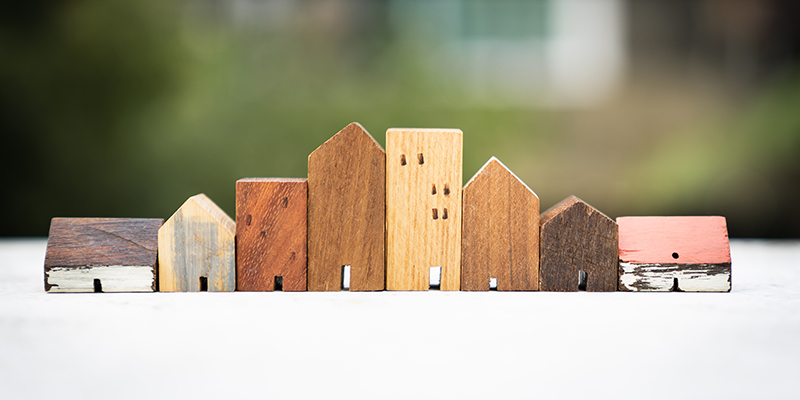 House model on wood table. Real estate agent offer house, property insurance and security, affordable housing concepts