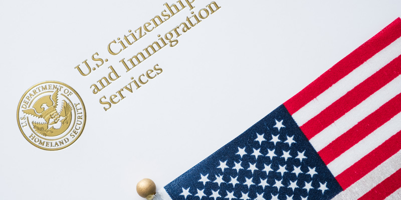 Seal for U.S. Citizenship and Immigration services with U.S flag