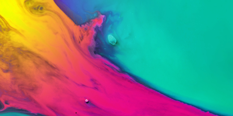 Creative abstraction in the 2020 color trend in yellow, orange and pink colors on an azure background