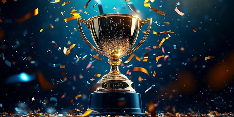 Trophy on a pedestal with confetti