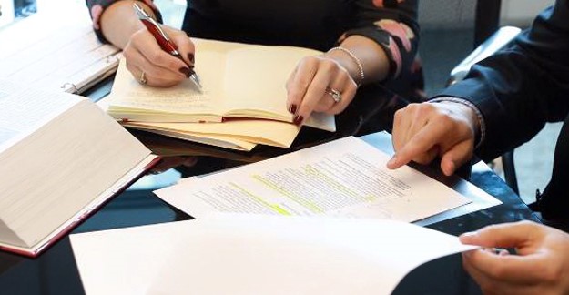 People reviewing documents