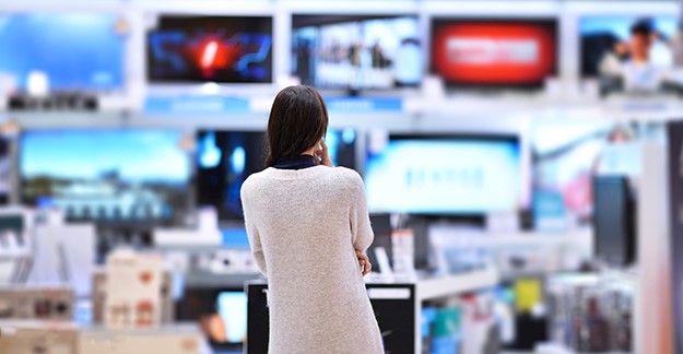 Woman looking to buy a television