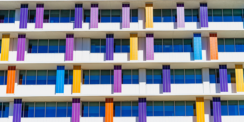 blue windows and multicolored banners
