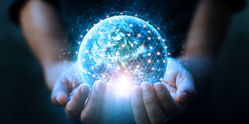 Blue light globe in hands