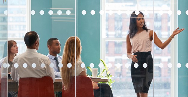 Woman leading a meeting in conference room