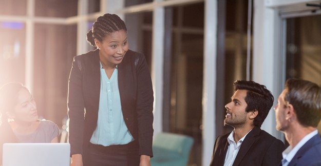 Woman leading a meeting with two men