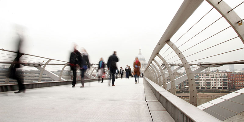blur motion image of people walking on bridge