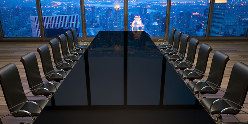 empty board room table and chairs
