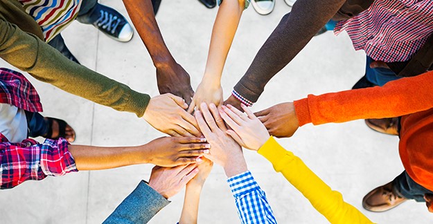 Diverse hands in a pile