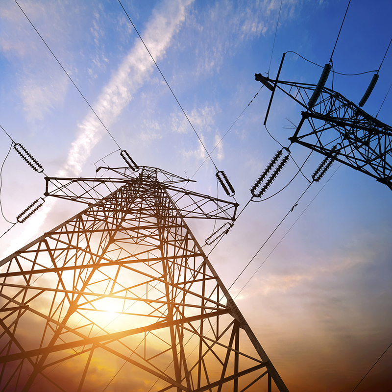 Electric towers and wires at sunset
