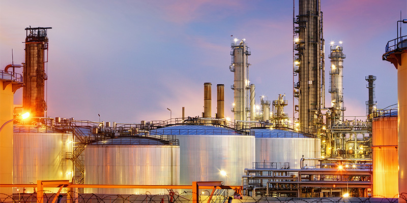 Oil refinery at sunset