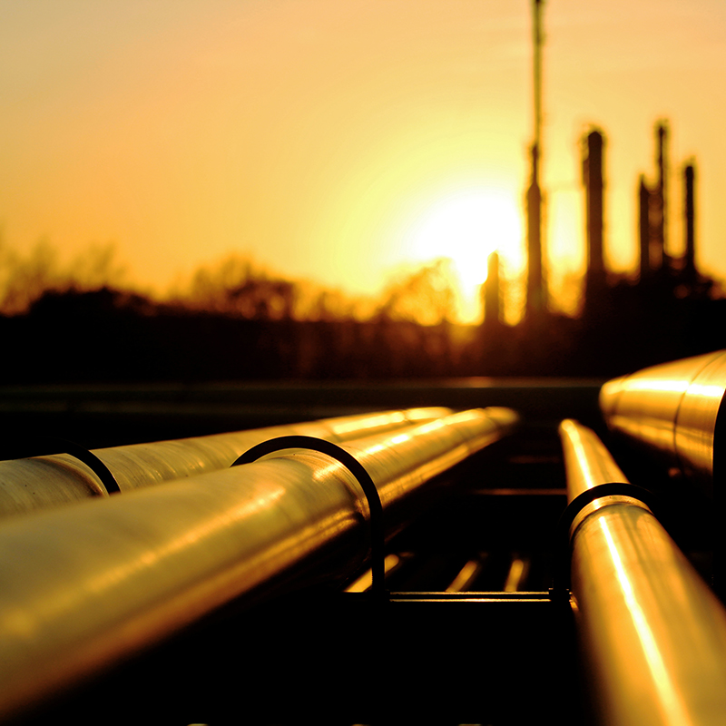 Golden pipes going to oil refinery