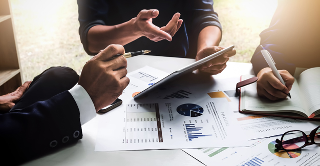People meeting and reviewing business documents