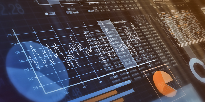 Close-up view of financial graphs, bar, circle and line charts