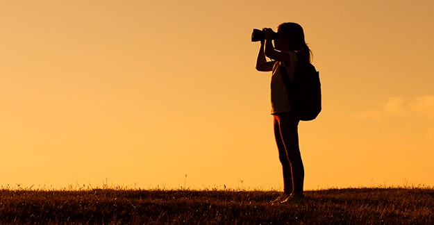 Girl holding binoculars