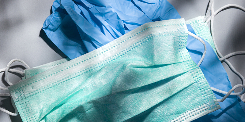 Disposable mask against Coronavirus 2019-nCoV droplet infection and an antibiotic syringe