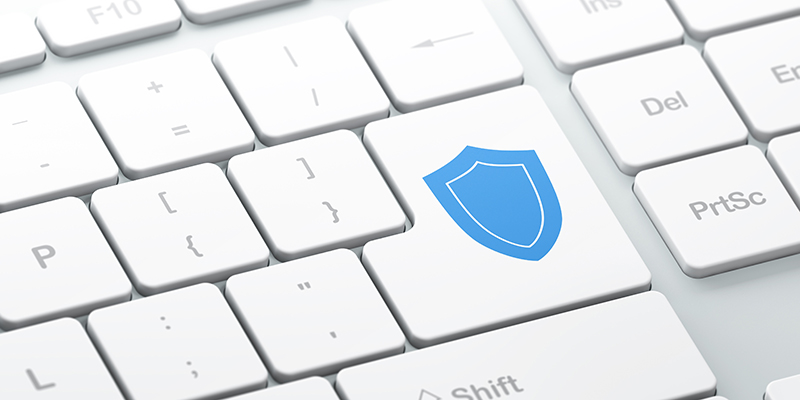 Enter button with Shield on computer keyboard background