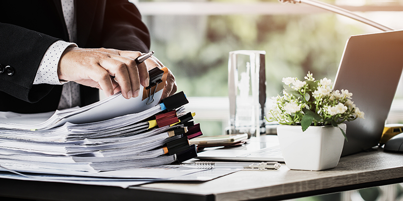 man working on reports
