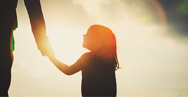 silhouette of little girl and parent