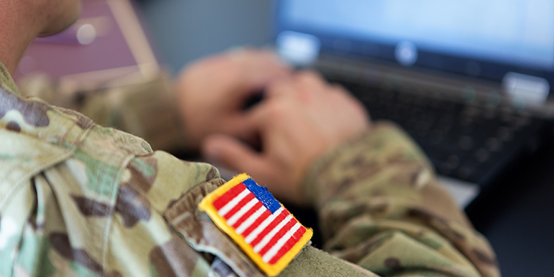 soldier working on laptop