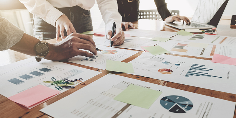 Business People Analyzing Statistics Business Documents