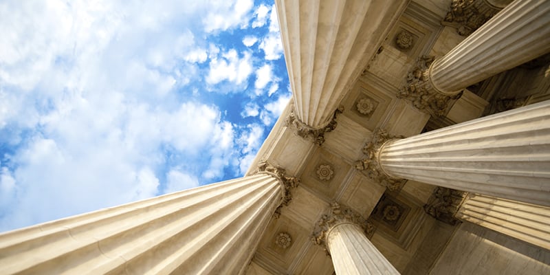 Upward view of Supreme Court columns