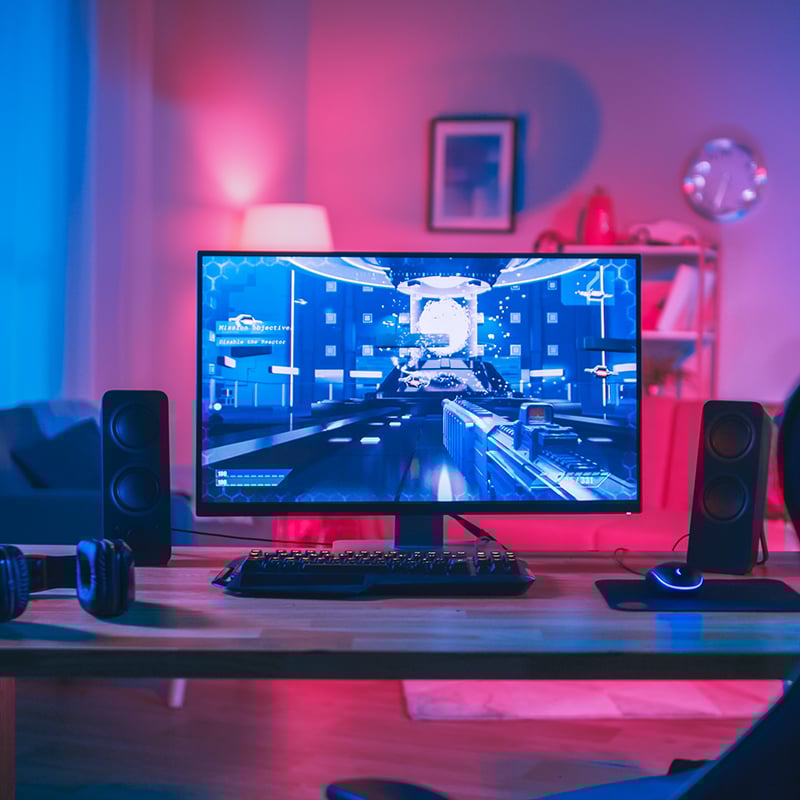 Powerful Personal Computer Gamer Rig with First-Person Shooter Game on Screen