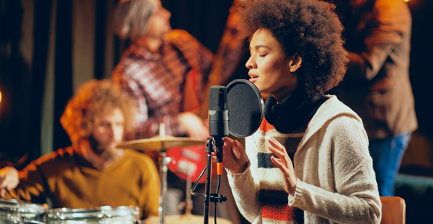 woman singing in studio