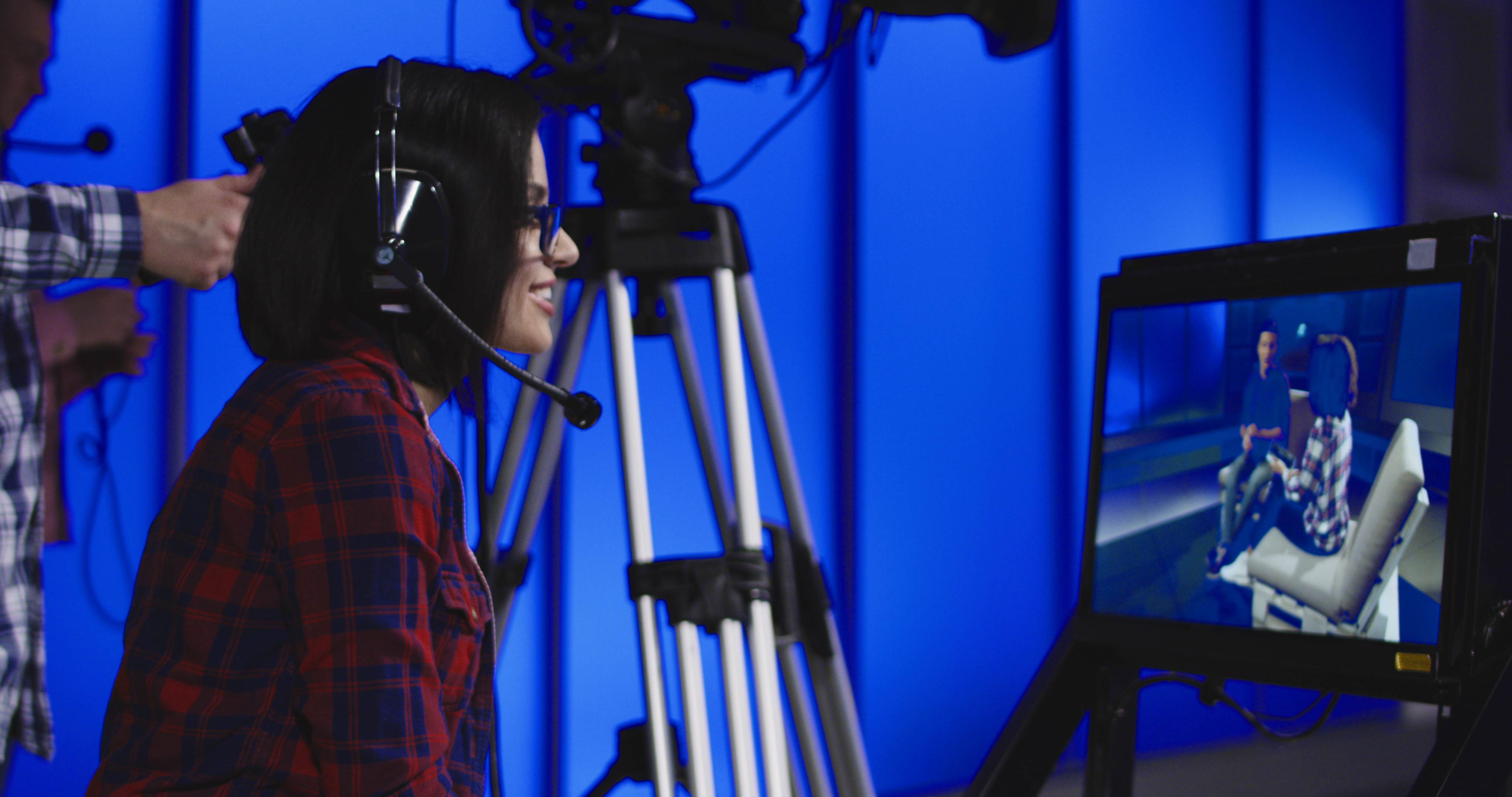 Woman giving instruction in newsroom